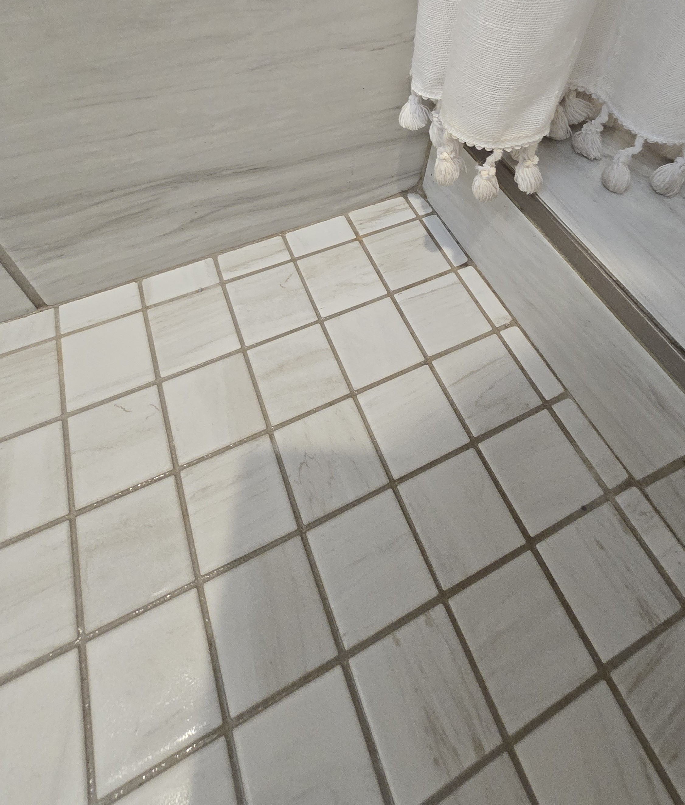 Shower floor corner before cleaning